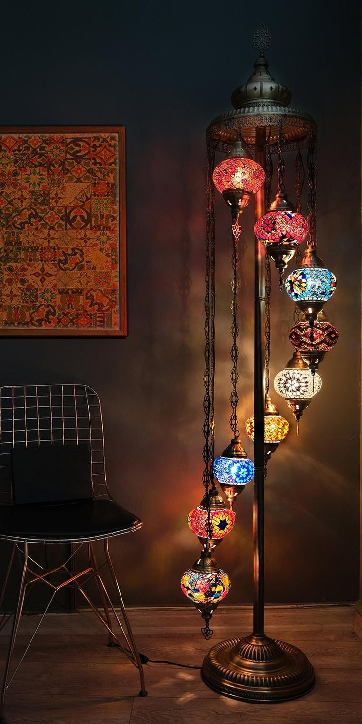 a lamp that is sitting on top of a table next to a chair and rug