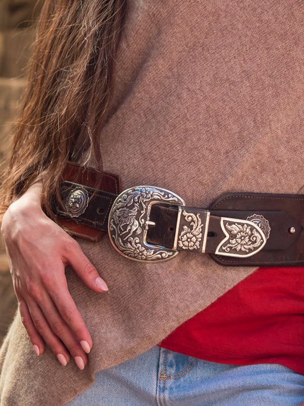 Nothing better than hand scrolled and engraved ranger buckles with bucking horses. I sure love our Wyoming heritage "Let's go Cowboy!" Each element is sawn out of thick sterling, and stamped and engraved. True works of art! "Ranger" buckles are inspired, artful creations. They look amazing with our vintage latigo belts or Wild West turquoise concho belts. A beautiful combination of hand carved floral designs. We can do brands logos, you name it we can do it! Engraved Western Belt Buckles For Western-themed Events, Hand Tooled Silver Leather Belt Buckles, Engraved Western Belt Buckles For Rodeo, Engraved Western Belt For Ranch, Western Style Engraved Belt For Ranch, Western Concho Belt Buckles For Western-themed Events, Silver Western Belt Buckles For Rodeo, Engraved Adjustable Belt Buckles For Rodeo, Adjustable Engraved Belt Buckles For Western-themed Events