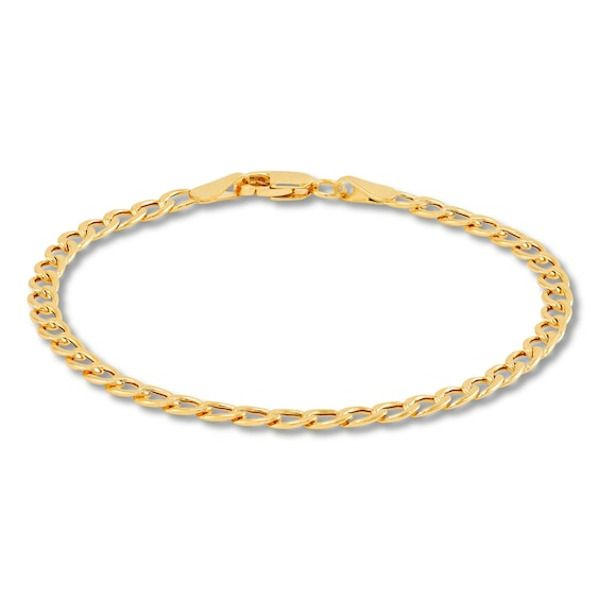 This stylish bracelet features hollow curb links and is crafted in iconic 14K yellow gold for a classic look. The chain measures 6 inches and secures with lobster clasp. The chain width is 3.2mm. Classic Link Charm Bracelet With Curb Chain, Yellow Gold Link Charm Bracelet With Curb Chain, Yellow Gold Charm Bracelet With Curb Link Chain, Classic Gold Bracelet With Oval Link Curb Chain, Classic Cuban Link Bracelet With Lobster Clasp, Classic Yellow Gold Charm Bracelet With Curb Chain, Yellow Gold Cuban Link Bracelet With Lobster Clasp, Gold Link Chain, Kay Jewelers