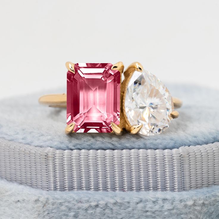 Meet our Pink Tourmaline & Moissanite Twin Ring--a beautiful pair of gemstones set in 14k gold. One stone is a vibrant pink tourmaline, and the other is a shimmering moissanite. They're held in place by prongs that highlight their beauty. This ring is perfect for engagements or as a meaningful gift, symbolizing harmony and connection in a timeless design. Pink Tourmaline & Moissanite Twin Ring, Dual Gemstone Toi Et Moi Ring, 14k Gold Pair Ring, Engagement Ring Gift, Prong Setting, Birthstone ★ ★ ★ ★  CUSTOM/DUTY-FREE SHIPPING WORLDWIDE, BUYERS DON'T HAVE TO PAY ANY CUSTOM FEES WHILE IMPORTING ★ ★ ★ ★  Details Made to order Material: 14k/18k Gold Color Options: Yellow Gold, White Gold, Rose Gold ★ Stone 1 Pink Tourmaline, Emerald Cut  Size: 7x9mm Approx Weight (Ct): 2.46 ★ Stone 2 Moissanit Pink Tourmaline Jewelry, Pink Engagement Ring, Moon Party, Pink Tourmaline Ring, Tourmaline Jewelry, Pink Topaz, Tourmaline Ring, Stone Engagement Rings, Aquamarine Rings