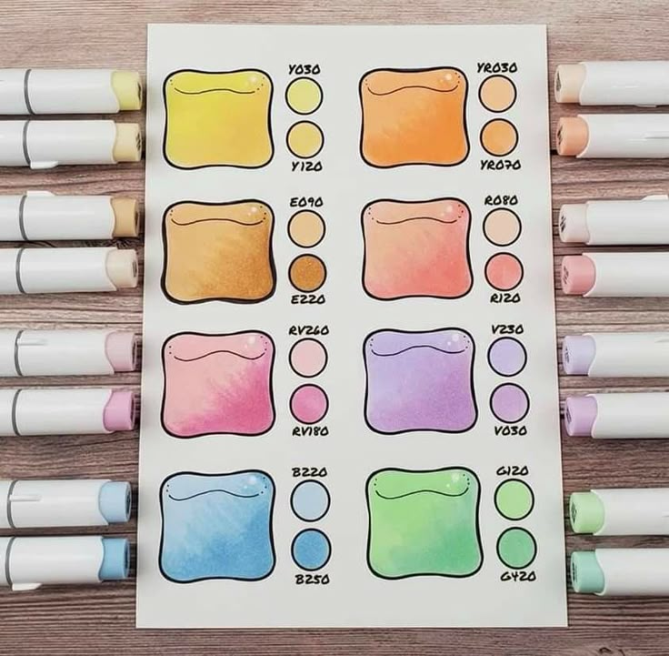 some crayons are lined up next to each other on a table with markers