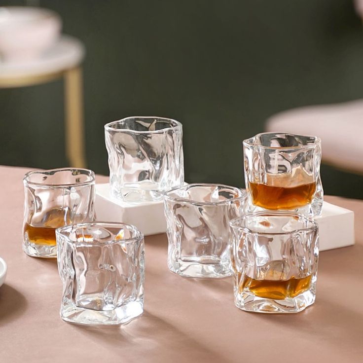 several shot glasses are sitting on a table