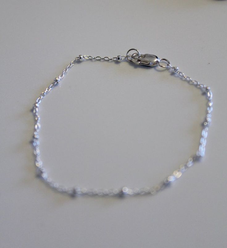 Dainty sterling silver bracelet made from a dainty cable chain with sterling silver beads. Finished with a sterling silver clasp and jump rings. Looks classy all on it's own or layer it with other bracelets. Different sizes are available at check out. All jewelry comes ready for gift giving. Minimalist Sterling Silver Bracelet With Hypoallergenic Round Beads, Minimalist Hypoallergenic Sterling Silver Bracelet With Round Beads, Sterling Silver Satellite Chain Bracelet As Gift, Sterling Silver Round Beads Minimalist Bracelet, Minimalist Sterling Silver Bracelet With Beads, Sterling Silver Chain Bracelet With Round Beads For Gift, Sterling Silver Dainty Beaded Bracelets, Minimalist Sterling Silver Bracelet With Round Beads, Silver Chain Bracelet With Satellite Chain As Gift