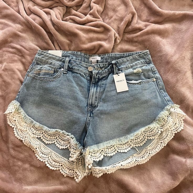 Distressed Denim Shorts Ruffle Lace New Size 14 Upcycled Jean Shorts, Summer Denim Bottoms With Lace Trim, Denim Bottoms With Lace Trim For Summer, Spring Denim Jean Shorts With Ruffles, Ruffled Denim Jean Shorts For Spring, Spring Ruffled Denim Jean Shorts, Spring High-waisted Shorts With Lace Trim, Forever 21 Cutoff Shorts For Spring, Forever 21 Spring Cutoff Shorts