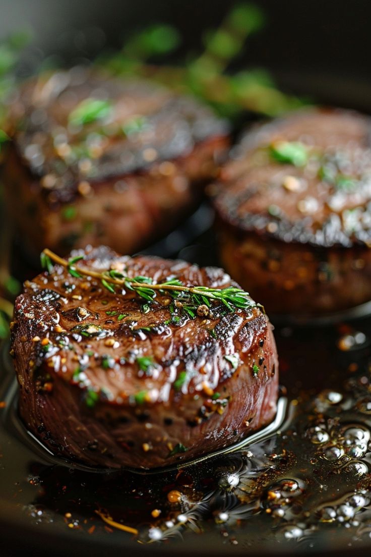 Grilled steak medallions garnished with fresh herbs. How To Cook The Perfect Filet Mignon, Filet Mignon Recipes Iron Skillet, Filet Mignonette In Cast Iron, Cook Filet Mignon In Cast Iron, Seared Filet Mignon Cast Iron Skillet, Best Way To Cook Filet Mignon In Oven, Filet Cast Iron Skillet, Filet Mignon Seasoning, Filet In Cast Iron