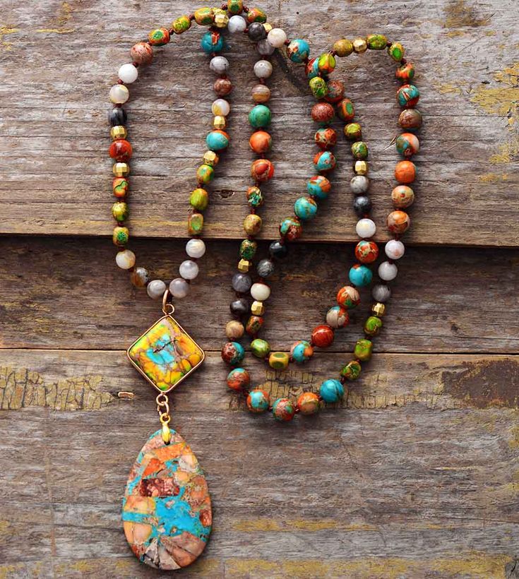 This eye-catching Intense Jasper Spiritual Necklace is you perfect boho chic statement piece! Featuring natural stones designed to elevate connectedness, healing and strength. Wear this with a plain dress or an equally vibrant clothing reflecting your style. ✔️ 100% Satisfaction guarantee: If you aren’t in LOVE with your purchase, please let us know within 60 days of receiving your items, and you’ll receive a stress free refund. Materials: Onyx, Seed Beads Metal: Copper Purchase helps support 10 Coast Cowgirl, Collar Hippie, Spiritual Necklace, Treasure Jewelry, Geometric Pendant Necklace, Agate Pendant Necklace, Gemstone Beaded Necklace, Long Beaded Necklace, Beaded Pendant Necklace