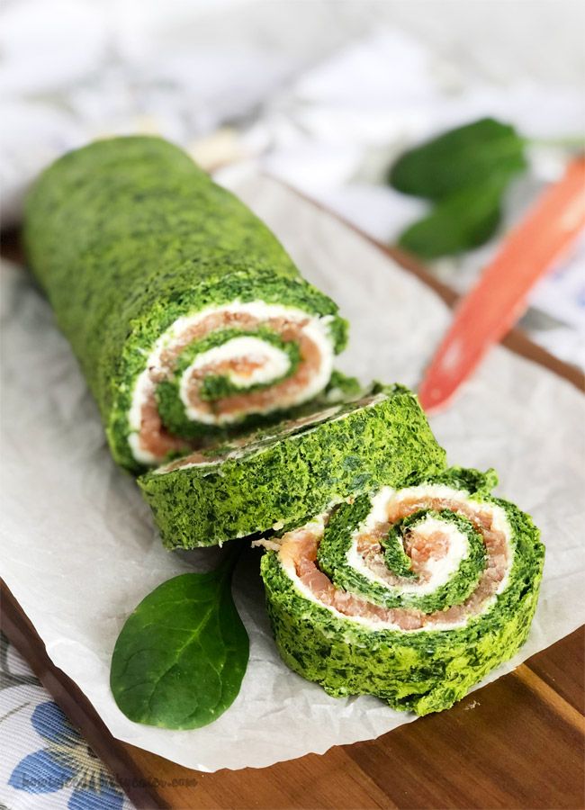 there is a roll that has been made to look like spinach and cream cheese