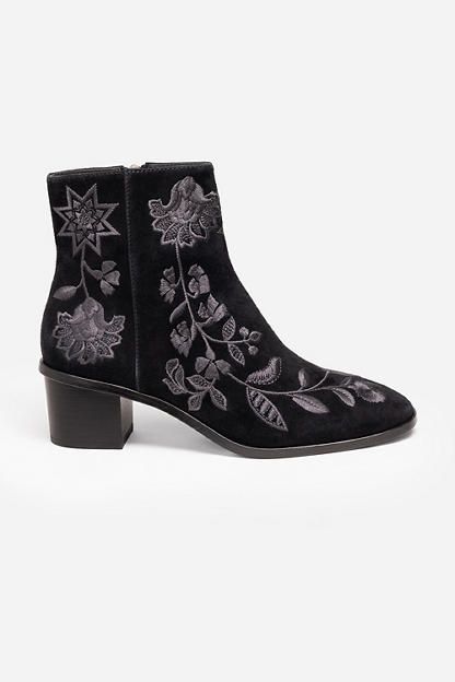 Crafted from 100% luxurious suede, the Chiara Embroidered Suede Booties are the perfect statement piece for the cooler season. Featuring intricate floral embroidered detailing on a rich black suede backdrop, these booties are finished with a rounded toe and classic block heel. Pair with a silk blouse and cropped denim to highlight these unique boots. Johnny Was Women's Chiara Embroidered Suede Bootie in Black, Size 8, Silk/Denim/Suede, Floral Unique Boots, Boho Chic Outfits, Pretty Shoes, Cropped Denim, Johnny Was, Leather Care, Suede Booties, Boot Shoes Women, Cute Fashion