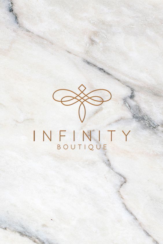 the logo for infinity boutique is shown on a white marble surface with gold lettering