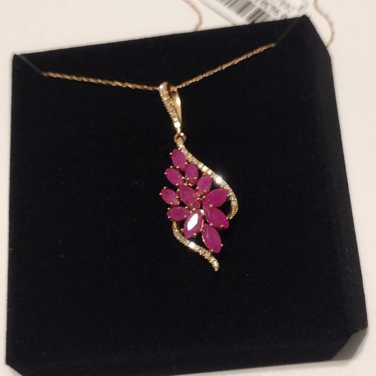 Ruby & Diamond Flower Cluster 18" Necklace In 14k Gold. Live Your Floral Dreams With This Stunning Marquise-Cut Ruby And Diamond Flower Cluster Pendant Necklace. Ruby: 2-3/4 Ct. T.W. Diamond: 1/6 Ct. T.W. 14k Rose Gold Approx. Length: 18"; Approx. Drop: 3/8" Spring Ring Clasp Closure; Rope Link Chain Formal 14k Gold Flower Jewelry, Elegant 14k Gold Flower Jewelry, Formal 14k Gold Stamped Flower Jewelry, Elegant 14k Flower Shaped Jewelry, Formal 14k Stamped Flower Jewelry, Elegant 14k Gold Flower Pendant Necklace, Elegant 14k Stamped Flower Pendant Jewelry, Ruby Cluster Jewelry With Diamond Accents, Elegant 14k Stamped Flower Pendant Necklace