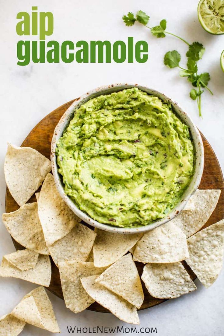 a bowl filled with guacamole surrounded by tortilla chips