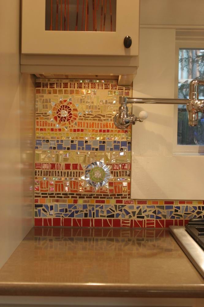 a stove top oven sitting inside of a kitchen next to a sink and countertop