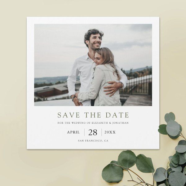 the save the date photo card is shown with eucalyptus leaves