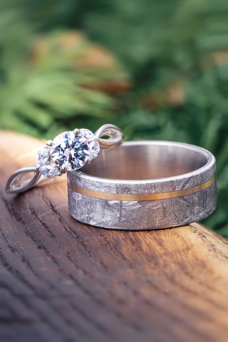 Meteorite Wedding Band and Moissanite Engagement Ring Meteorite Ring Engagement, Custom Wedding Rings Sets, Unique Wedding Ring Sets, Meteorite Engagement Ring, Meteorite Rings, His And Her Wedding Rings, Meteorite Wedding Band, Meteorite Jewelry, Jewelry By Johan