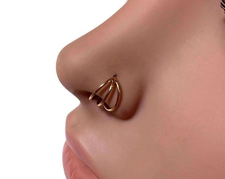 I made this lovely septum ring from solid 14 karat rose gold. It's made to look like a triple hoop, sleek and simple with a high polish. Twist open and close to keep the circle shape, the ends are smooth for easy insertion. Can be worn in a variety of piercings. I can make the ring in various thicknesses and diameters which you can choose at check out. Sizes thickness measure as follows: 18 gauge = 1.02mm 20 gauge = .812mm 22 gauge = .643mm Check out my other nose rings here: https://www.etsy.co Rose Gold 14k Hoop Septum Ring, Minimalist Hypoallergenic Rose Gold Septum Ring, Minimalist Rose Gold Septum Ring As Gift, Hypoallergenic Rose Gold Hoop Septum Ring, 14k Rose Gold Nose Rings, Hypoallergenic Rose Gold Septum Ring Gift, Internally Threaded Rose Gold Hoop Nose Ring, Rose Gold Hoop Nose Rings As Gift, 14k Rose Gold Nose Rings As Gift