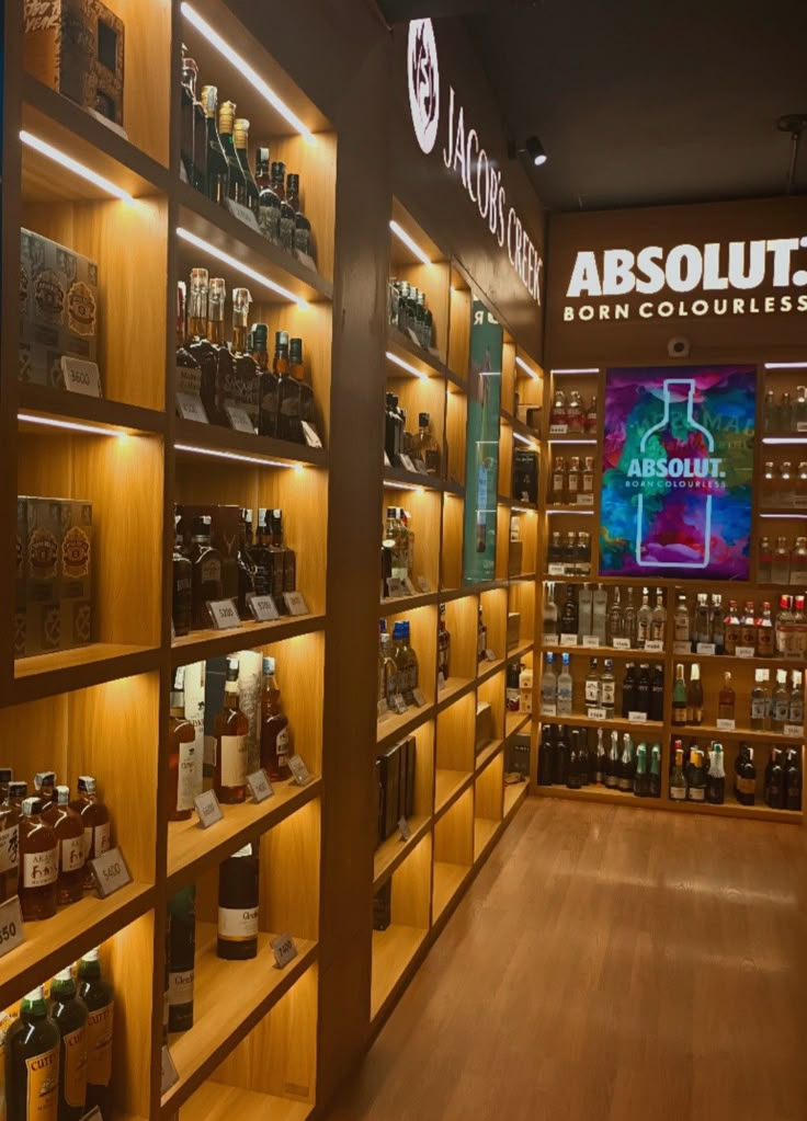 the inside of a liquor store with shelves full of bottles