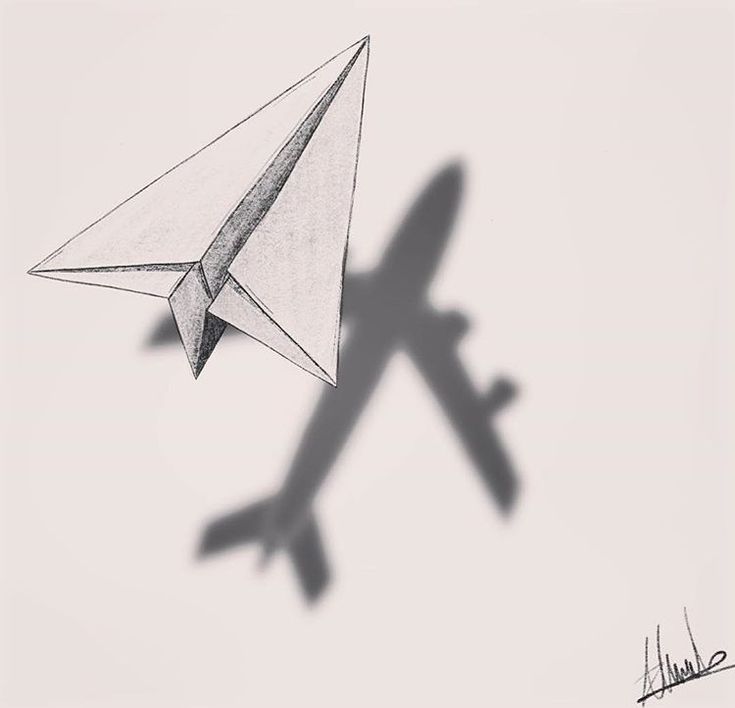 the shadow of an airplane and a paper plane on a white background is seen in this image