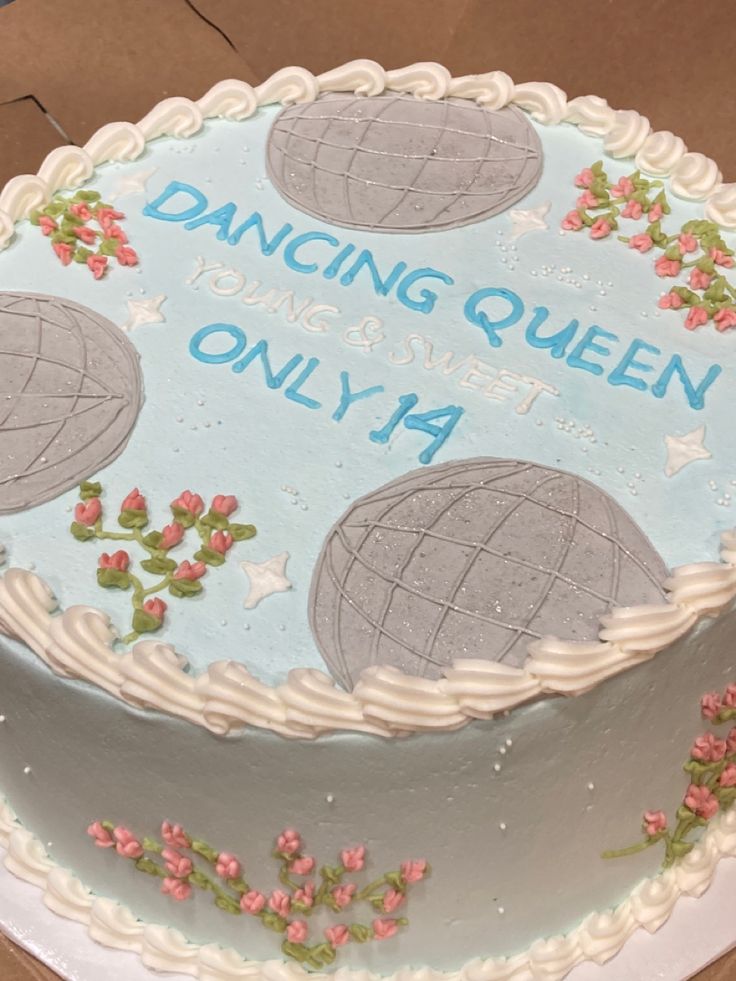 a cake that is sitting on top of a table with the words dancing queen on it