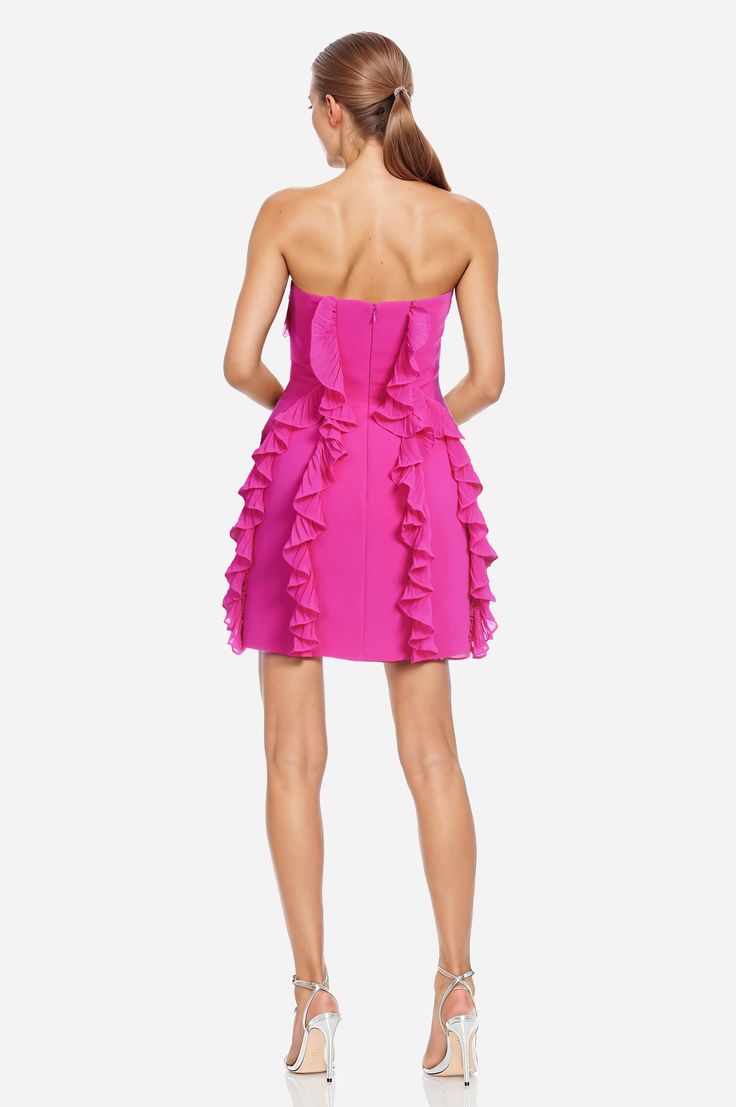 Party in the front AND the back… The Khefri is bound to wow everyone - at every angle. From the front, ruffles detail the bodice while they gracefully cascade down the bottom of the dress. And the back does not disappoint - two defined lines of ruffle give this mini dress the finish that it needs. Peeking out around the hemline is a layer of tulle for the perfect flounce and bounce. No need for accessories, the dress says it all. Throw it on for a girl's night or date night out or that showstopp Formal Mini Dress With Ruffles And Sweetheart Neckline, Elegant Chiffon Party Dress With Ruffle Hem, Strapless Party Dress With Ruffled Skirt, Party Chiffon Dress With Ruffle Hem, Gala Strapless Dress With Ruffles And Fitted Bodice, Gala Chiffon Dress With Lined Bodice, Chiffon Gala Dress With Lined Bodice, Strapless Ruffled Mini Dress For Gala, Elegant Evening Strapless Dress With Ruffled Skirt