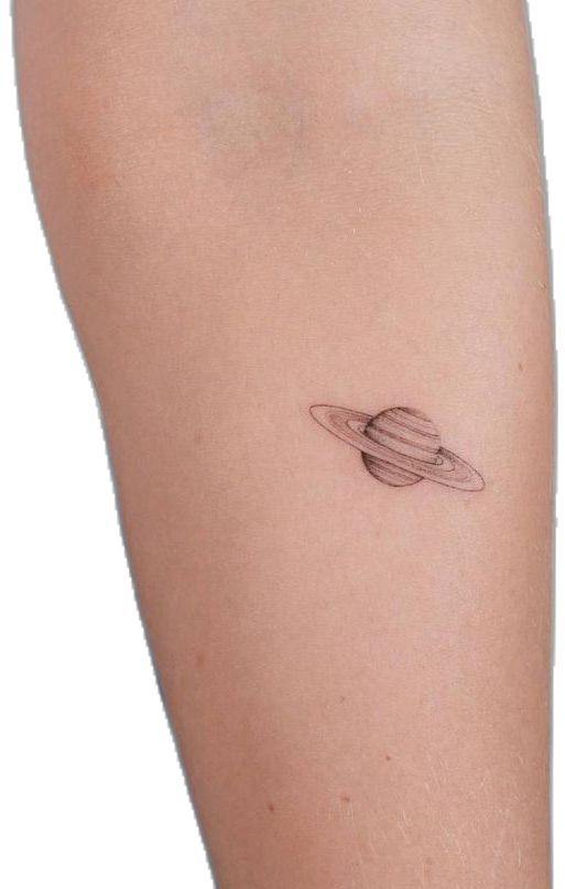 small saturn tattoo on the right thigh