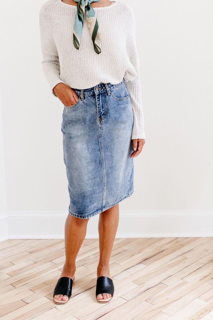 The 'Kyra' is another one of our very own exclusive denim skirts. Designed with everyday wear in mind, this skirt will pair well with just about any casual top in your wardrobe! This knee length denim skirt is 100% cotton and does not have stretch giving it a vintage vibe we love! Every woman needs a classic denim pencil skirt in her closet and this skirt is an excellent choice! Available in a classic light wash or statement black. 100% Cotton Machine Wash Cold Gentle Cycle Do Not Bleach Hang to Dark Wash Cotton Mini Skirt, Dark Wash Cotton Denim Mini Skirt, Chic Non-stretch Medium Wash Denim Skirt, Non-stretch Denim Pencil Skirt, Casual Medium Wash Denim Midi Skirt, Relaxed Denim Skirt For Fall, Relaxed Fit Denim Skirt For Fall, Denim Relaxed Fit Skirt For Fall, Spring Denim Pencil Skirt