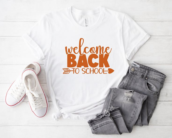 Welcome back to school in style with this fun and vibrant T-shirt featuring an orange colored print that screams back-to-school excitement! Made from soft and comfortable fabric, this tee is perfect for showing off your school spirit. Whether you're a student, teacher, or school staff member, this T-shirt is a must-have addition to your back-to-school wardrobe. Stand out from the crowd and make a statement with this unique and cheerful piece - get yours today and get ready to tackle the new scho Orange Typography, Wardrobe Stand, Welcome Back To School, School Staff, Student Teacher, The New School, Typography Prints, School Shirts, School Spirit