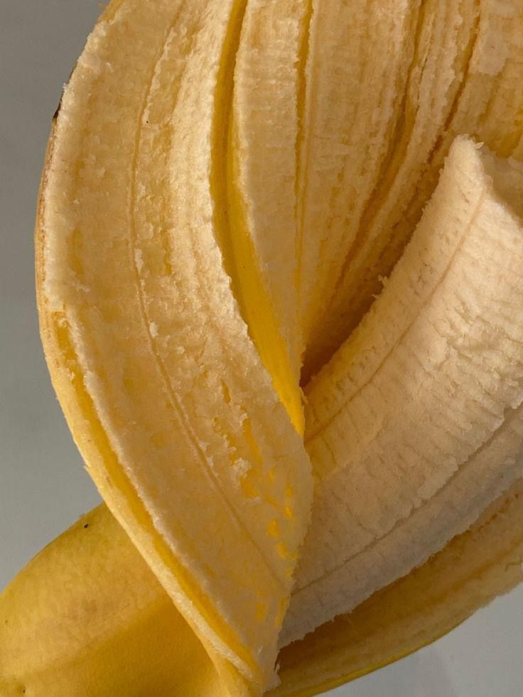 a peeled banana sitting on top of a table