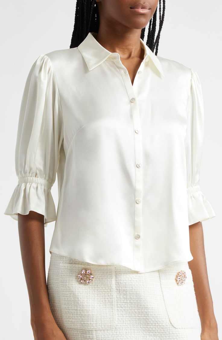 Elbow-length sleeves with ruffle cuffs frame this lustrous silk button-up cut in a relaxed fit with a sharp point collar. 22 1/2" length ( size Medium) Front button closure Point collar Elbow-length sleeves with ruffle cuffs Curved hem 100% silk Dry clean Imported Feminine Silk Button-up Blouse, Elegant Button-up Top With Blouson Sleeves, Elegant Top With Blouson Sleeves And Button-up, Formal Silk Blouse With Gathered Sleeves, Formal Silk Top With Gathered Sleeves, Luxury Silk Blouse With Button Cuffs, Elegant Puff Sleeve Blouse With Cuffed Sleeves, Elegant Silk Blouse With Cuffed Sleeves, Formal Satin Blouse With Button Cuffs