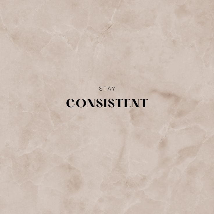 the words stay confident are written in black on a beige marble background that looks like paper