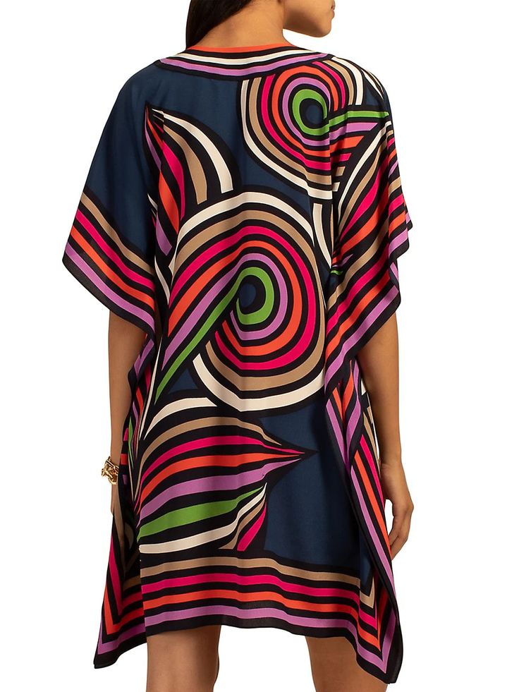 Lightweight and colorful, this floaty silk caftan is beautifully worn as a poolside swimsuit cover-up, or as a top for date night in the city; this wardrobe-essential is the piece you'll want in more than one color or pattern. Round, cutout neckline Relaxed, caftan fit Length: 36" Model is 5'10", wearing size XS/S FABRIC: Linear Fleur-de-Lis Silk Crepe de Chine 100% Silk Dry clean only Imported Vacation Rayon Cover-up, V-neck Viscose Kaftan For The Beach, Summer V-neck Tunic With Vibrant Print, Chic Multicolor Printed Swimwear, Chic Silk Kaftan For Beach Cover-up, Multicolor Tunic Style Beachwear Cover-up, Multicolor V-neck Kaftan For Resort, Chic Silk V-neck Kaftan, Chic Multicolor Kaftan With Kimono Sleeves