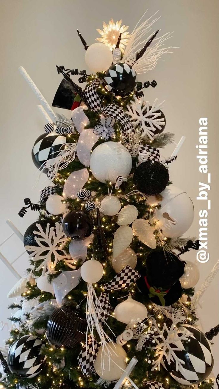 a black and white christmas tree decorated with balloons