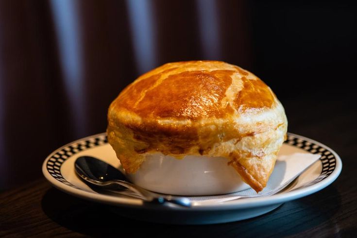 a pot pie sitting on top of a white plate