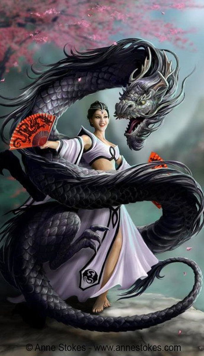 a woman in white dress holding a dragon