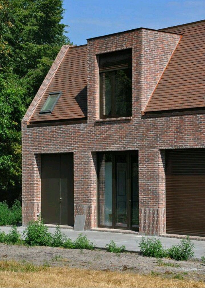 a large brick house with two garages