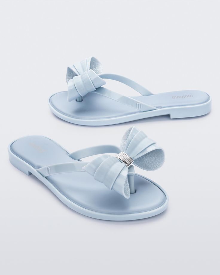 So lovely and luxe, the Slim Flip Flop brings bows to chic poolside style. Featuring a cushy footbed, metallic details and of course, ultra cute bow embellishments, slip these feminine flip flops on when you fancy some extra flair for a casual look. A little glam gets a lot of comfort. Dressy Flip Flops, Bow Embellishments, Punk Love, Poolside Style, Punk Movement, Poolside Fashion, Jelly Shoes, Viktor & Rolf, Quirky Design