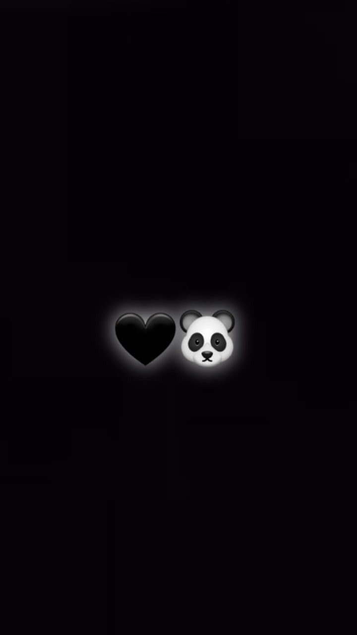 two panda bears in the dark with their faces glowing