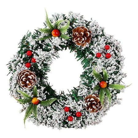 a christmas wreath with pine cones and berries