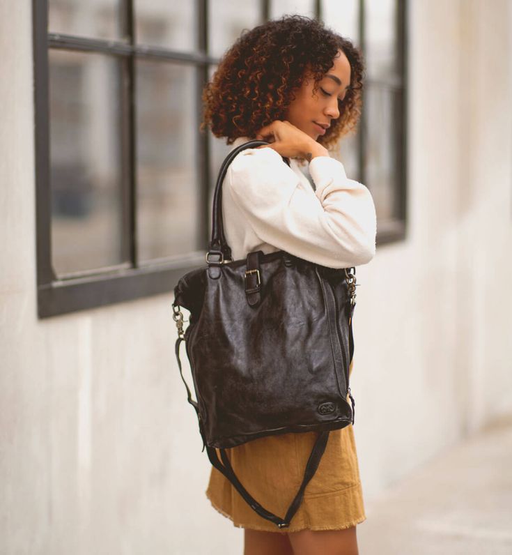 Update your everyday look with a clean-lines, useable tote (or crossbody) ideal for the lady boss who travels or for the sophisticated student. Sized right for carrying a laptop, MILDRED is your next leather carry-it-all handbag.  Dip Dyed to make each one unique, MILDRED has cushioned handles, a removeable, adjustable cross body strap, and zipper top closure to keep all things safe. Plenty of pockets for all your necessities, add MILDRED to your daily routine. Chic Everyday Crossbody Travel Bag, Chic Crossbody Travel Bag, Chic Crossbody Travel Bag For Everyday Use, Everyday Crossbody Briefcase With Top Carry Handle, Chic Travel Bag With Adjustable Strap For Daily Use, On-the-go Travel Bag With Adjustable Strap, Travel Bag With Leather Handles For On-the-go, Trendy Everyday Crossbody Travel Bag, Trendy Crossbody Travel Bag For Everyday Use