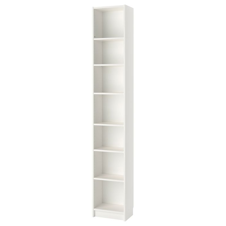 a tall white bookcase with four shelves