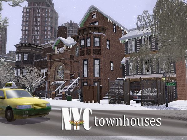 a yellow taxi cab driving down a snow covered street next to tall buildings and trees