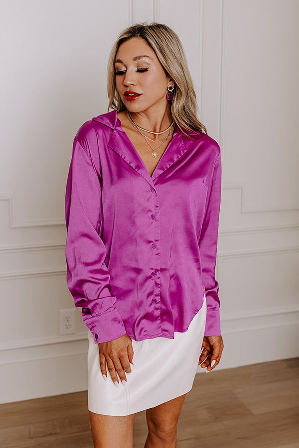 - You will love this luxe feeling pajama top! - A collared v-cut neckline - A button up front - Long sleeves with button closure cuffs - A relaxed silhouette that ends in a rounded hemline Chic Blouse With Button Closure For Loungewear, Chic Loungewear Blouse With Button Cuffs, Button Closure Top For Pajama Party In Spring, Chic Blouse With Buttons For Loungewear, Chic Blouse For Loungewear, Chic Solid Blouse For Loungewear, Chic Solid Color Blouse For Loungewear, Elegant Relaxed Fit Tops For Pajama Party, Chic Purple Top With Button Cuffs