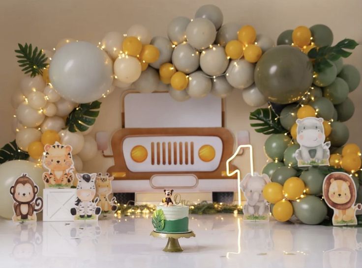 a safari themed birthday party with balloons and decorations