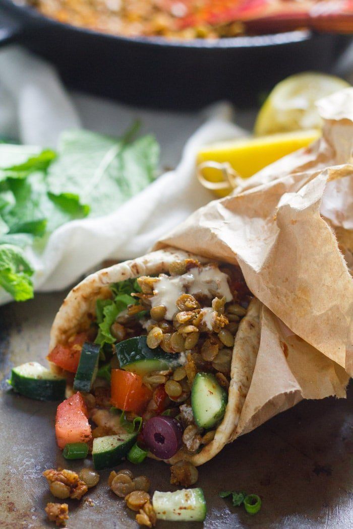 vegan lentil shawarma with vegetables and chickpeas on the side