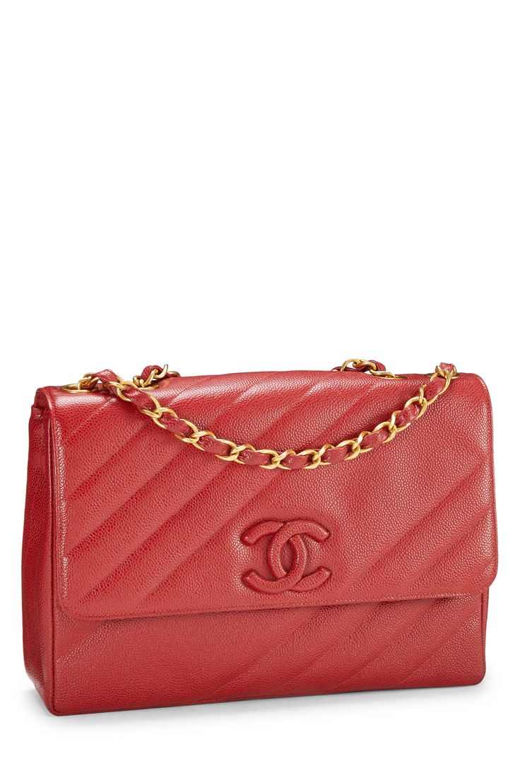 This Chanel bag features a quilted design, a flap closure with a turn lock, a gold tone chain strap, and the Chanel logo on the front. Classic Red Quilted Shoulder Bag, Red Quilted Shoulder Bag For Formal Occasions, Red Quilted Shoulder Bag For Formal Events, Formal Red Quilted Shoulder Bag, Classic Red Shoulder Bag With Cc Turnlock Closure, Red Leather Shoulder Bag With Cc Turnlock Closure, Formal Quilted Double Flap Bag, Luxury Red Shoulder Bag With Cc Turnlock Closure, Quilted Double Flap Shoulder Bag For Evening