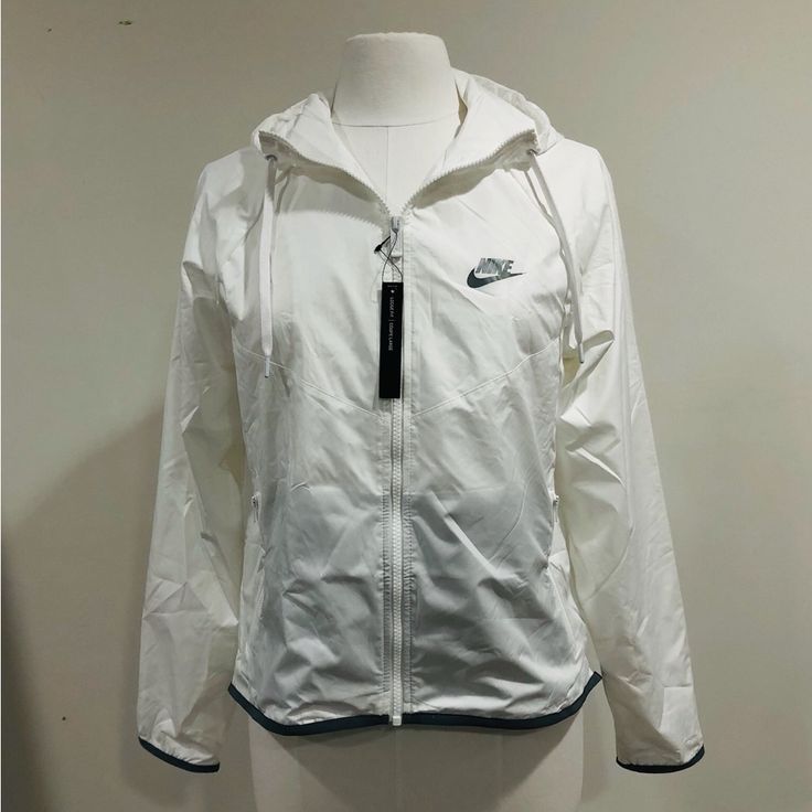 Nike Sportswear Windrunner Jacket Womens Size S Msrp: $90.00 + Tax New With Tags In Packaging Size: S Sku: Bv3939-100 Colors: White Lightweight And Cool, The Nike Windrunner Jacket Delivers Coverage For Your Run. Benefits: Sweat-Wicking Technology Helps You Stay Dry And Comfortable. Product Details: Loose Fit For A Relaxed, Easy Feel Full Zip With Zip Guard Elastic Cuffs Reflective Swoosh Logo On The Left Chest And Reflective-Design Graphic On The Lower Back Machine Wash Imported Not Intended Fo Casual Moisture-wicking Running Outerwear, Casual Moisture-wicking Outerwear For Running, Nike White Hooded Windbreaker, White Hooded Nike Windbreaker, White Moisture-wicking Track Jacket For Outdoor Activities, Sporty White Windbreaker For Sports Season, White Nike Track Jacket For Outdoor Activities, Nike White Track Jacket For Outdoor Activities, White Nylon Track Jacket With Moisture-wicking