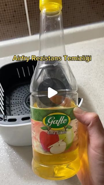 a bottle of apple cider sitting on top of a counter