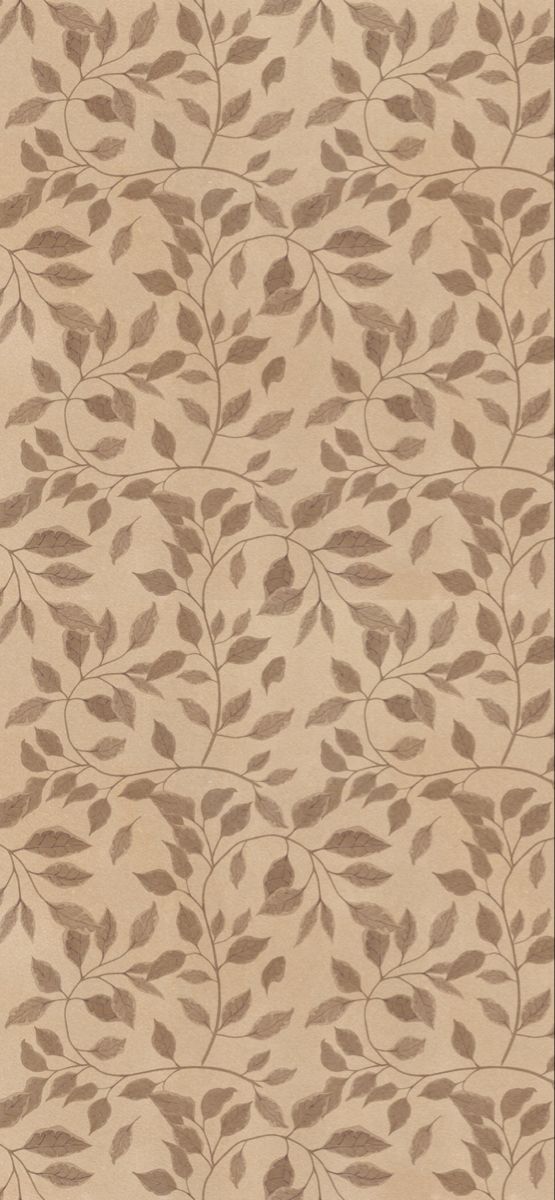 a beige rug with brown leaves on it