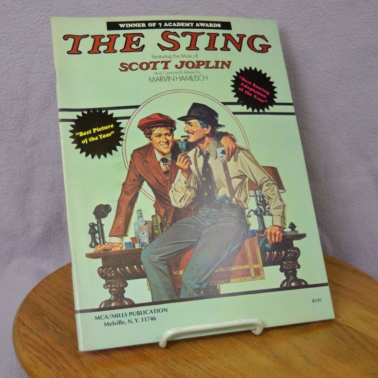 the sting by scott joplin on a wooden table