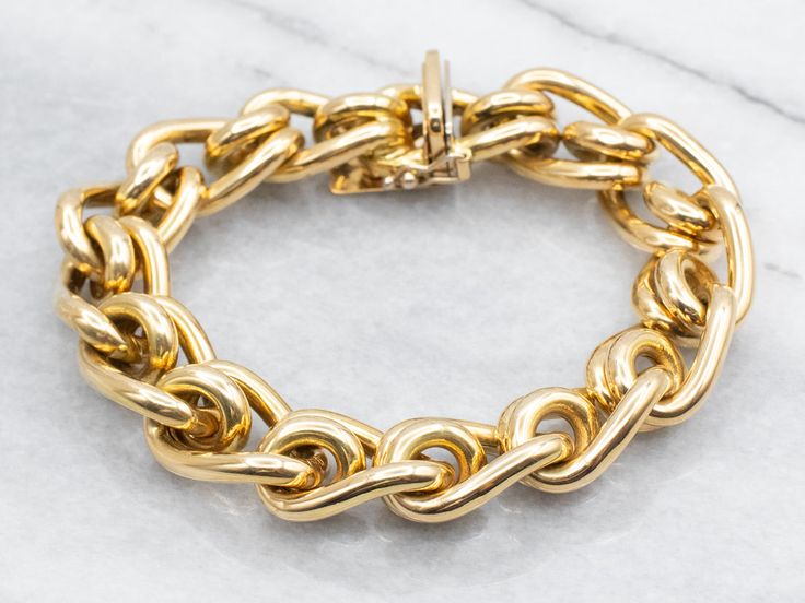 This bold gold chain bracelet is of the highest possible quality. The craftsmanship is exquisite, with polished round spacers creating a sleek contrast to the textured rings that form the basis of the bracelet. This is weighty and luxurious on the wrist and gives an aura of obviously good quality without being ostentatious. Metal: 18K Yellow GoldWidth of Chain: 13.4 mmLength of Chain: 7 1/2 InchesMarks: "ITALY" Stamped on the clasp Gold Chain Bracelet, Gold Link Chain, Textured Ring, Gold Bracelet Chain, Chain Bracelet, Gold Chain, Good Quality, Gold Chains, Aura