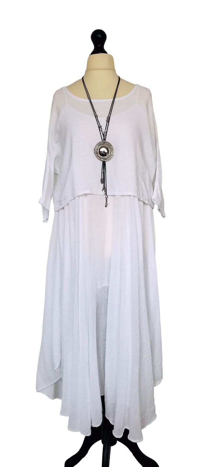 . Made In Italy Lagenlook White Cotton 2 Piece Dress . Stunning 2 piece dress consists of a longer length full floaty sleeveless dress fully lined and a short boxy tunic top with 3/4 length sleeves in a contrasting fabric . 100% cotton . One size - to fit UK sizes 12 14 16 . Bust on dress measures : 46 inches / 117 cms . Length of complete outfit from back of neck to bottom hem : 47 inches / 119 cms . Brand new with tags ( necklace not included ) . Visit our shop for lots more gorgeous Italian l White Two-piece Summer Dress, Summer Sleeveless Dress With Fake Two-piece Design, Summer Sleeveless Dress With Fake Two-piece Detail, Long Sleeve Dresses With Overlay For Summer, White Fake Two-piece Dress For Spring, Flowy Tunic Dress In Lagenlook Style, Sleeveless Two-piece Bohemian Dress, White Long Sleeve Dress For Layering, Bohemian Sleeveless Dress For Layering